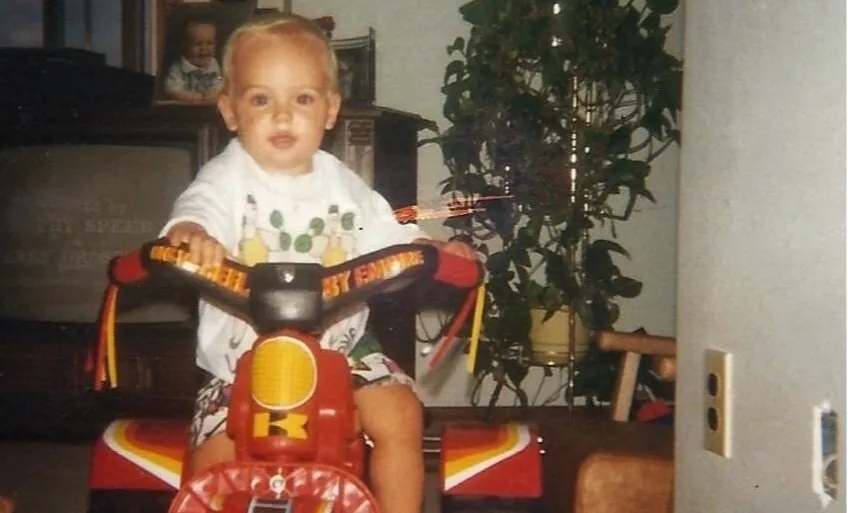 Young Lee Stuart on a Big Wheel tricycle