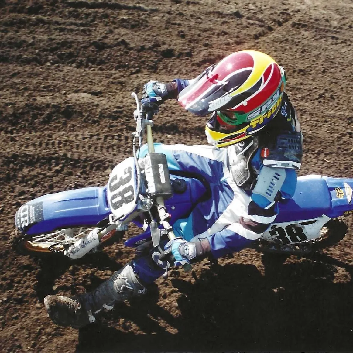 Young Lee Stuart cornering a Yamaha motocross bike numbered 38