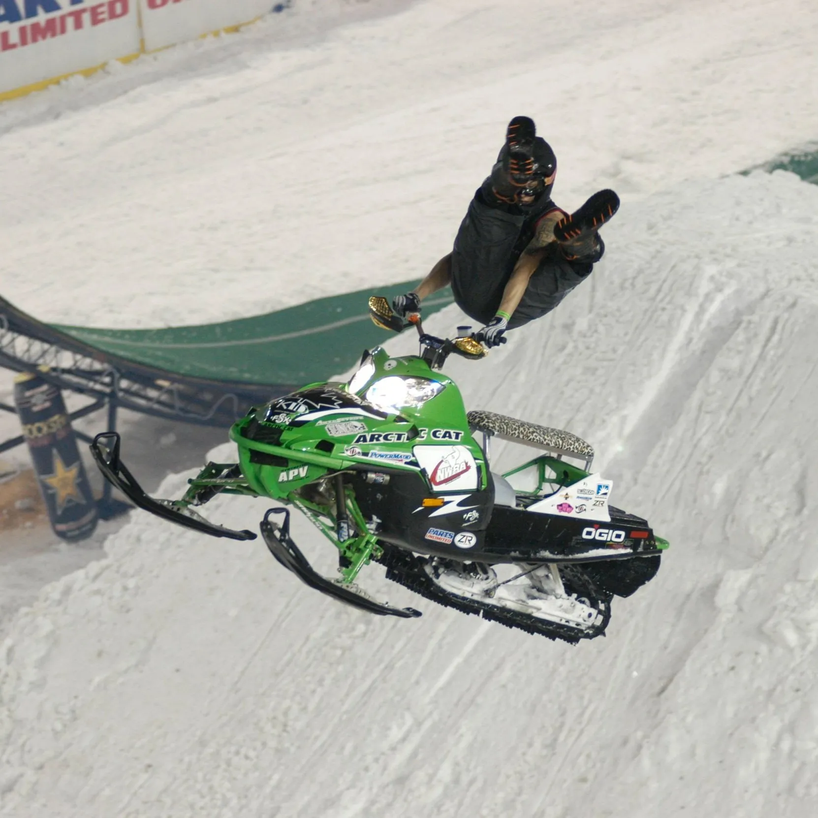 Lee Stuart on a snowmobile in competition